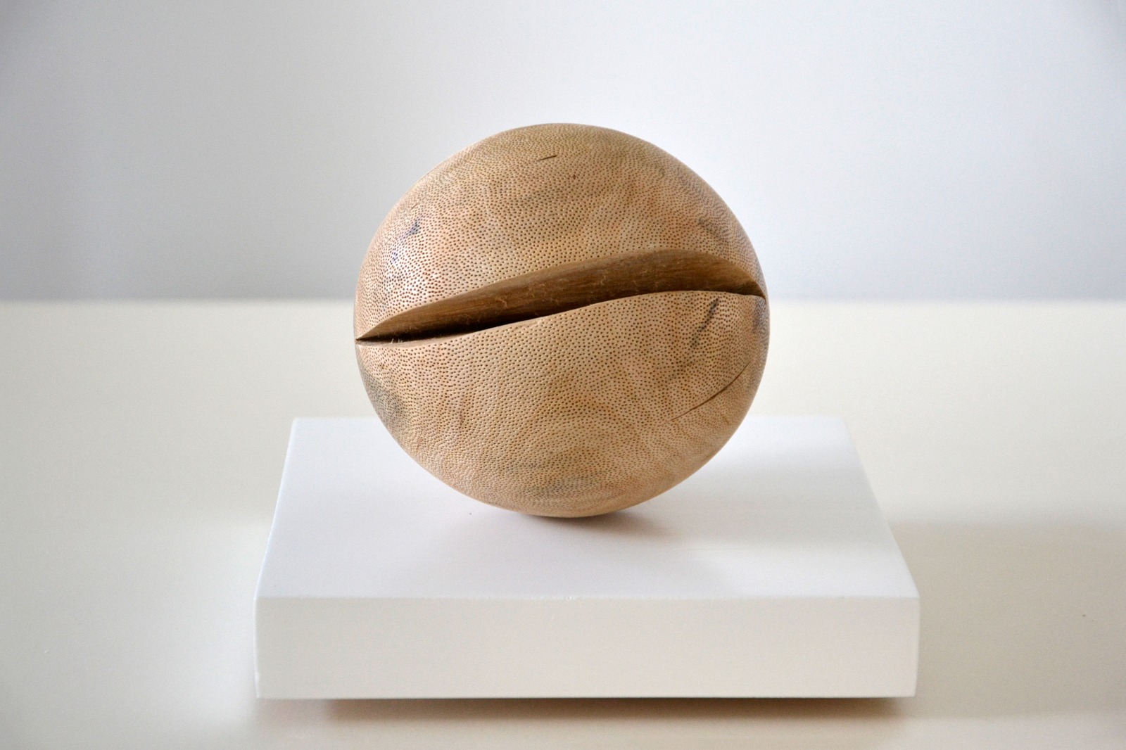 Wooden sphere sculpture on a pedestal, photo provided by Kulth